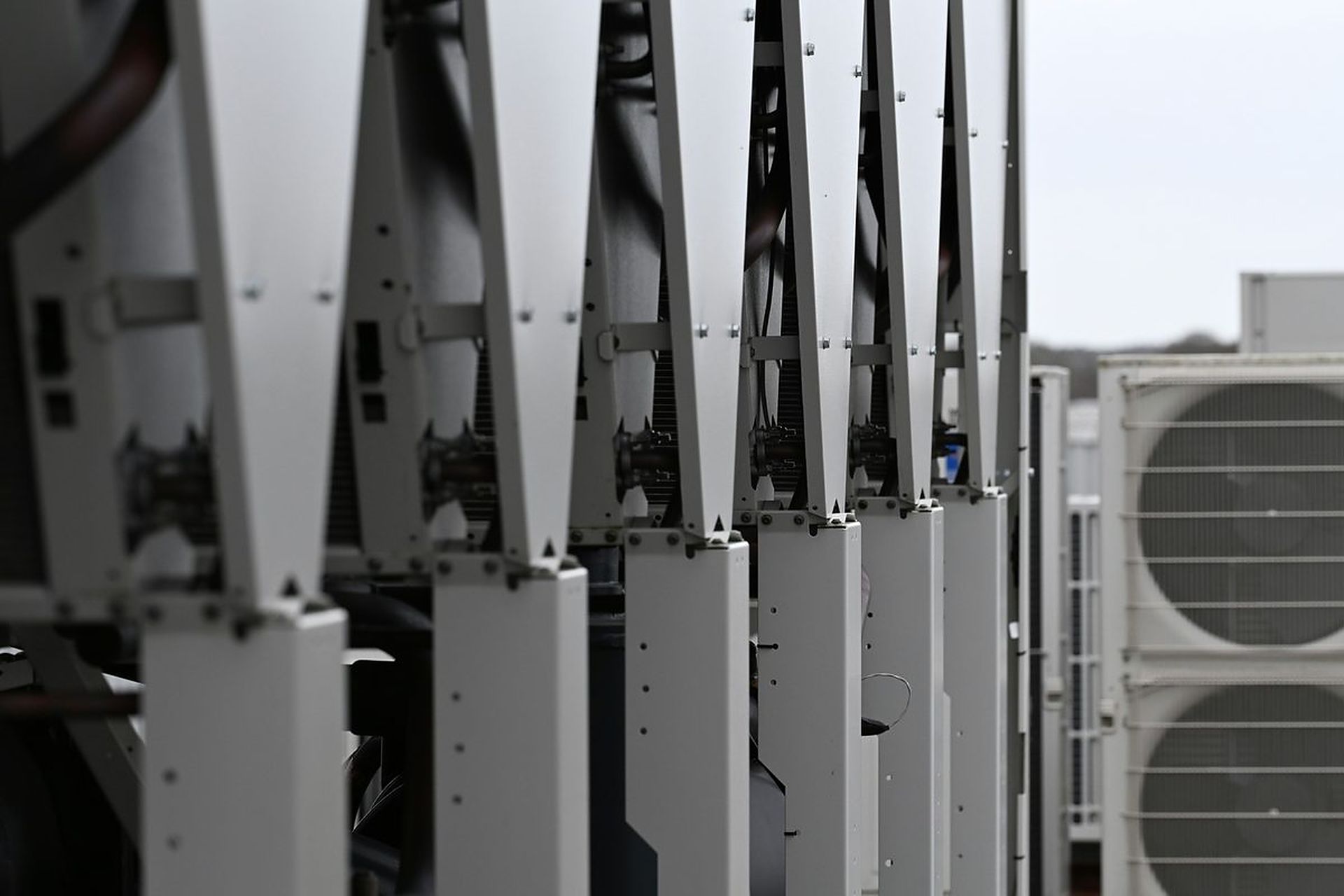Row of rooftop cooling and HVAC units