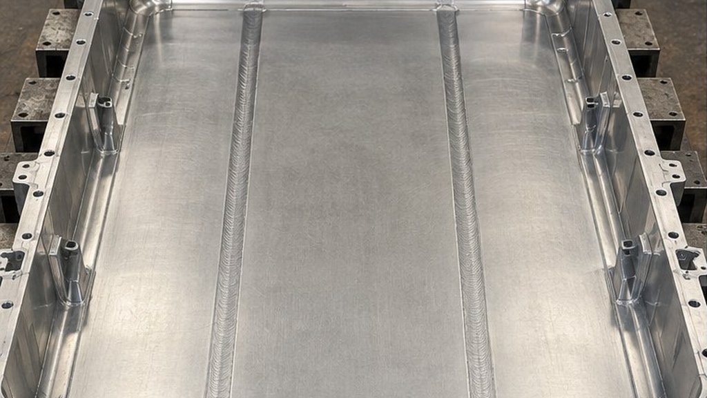 Aluminum EV battery tray with friction stir welded cold plate seams running along its floor